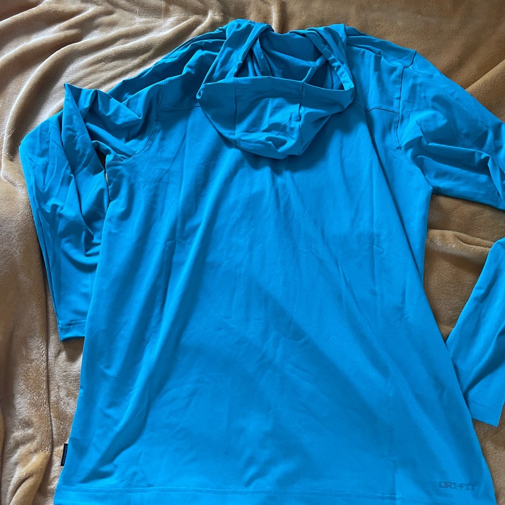 Long sleeve hooded Miami Dolphins Dri-Fit shirt. Brand New!